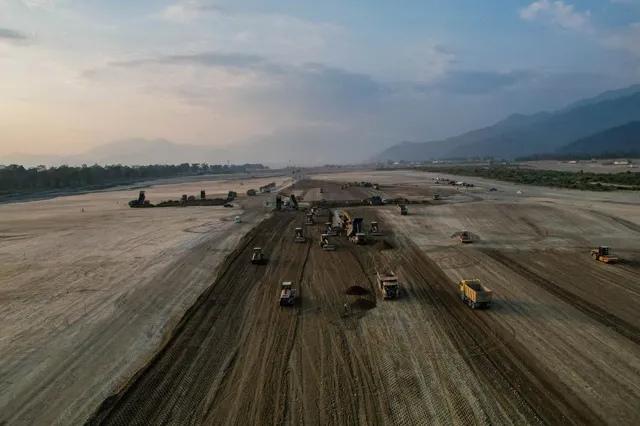 An aerial view of earthmoving equipment at work across the cleared site